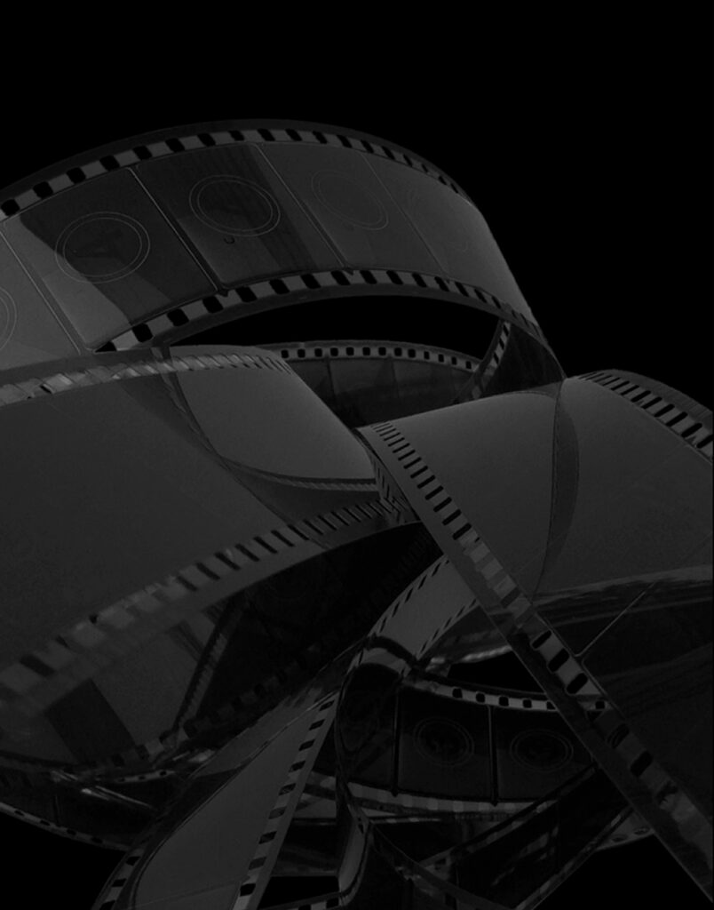 Curved strip of photographic film with sprocket holes winding across a dark background.